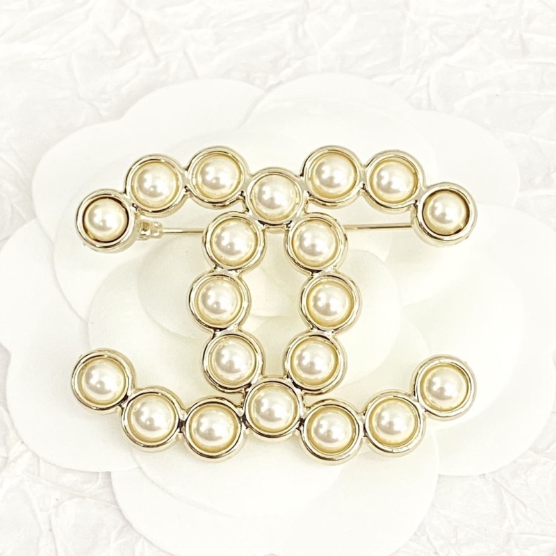 Ch*el brooches